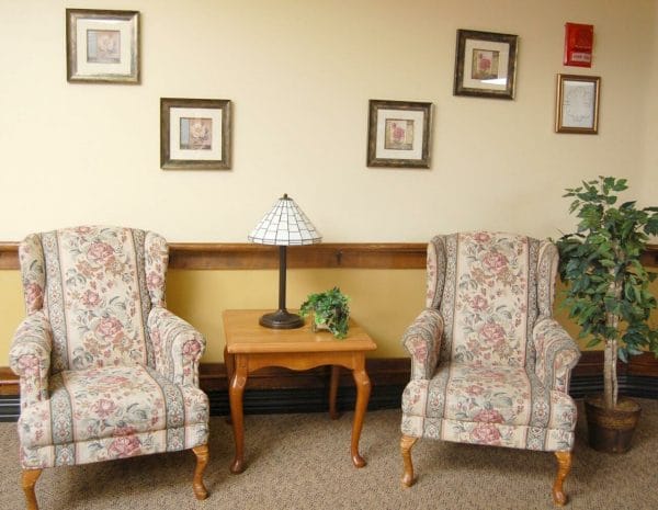 Wing back chairs in the Miller's Merry Manor - Portage common area