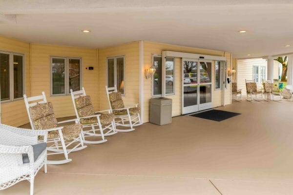 Front porch with rocking chairs at Hilltop Estates