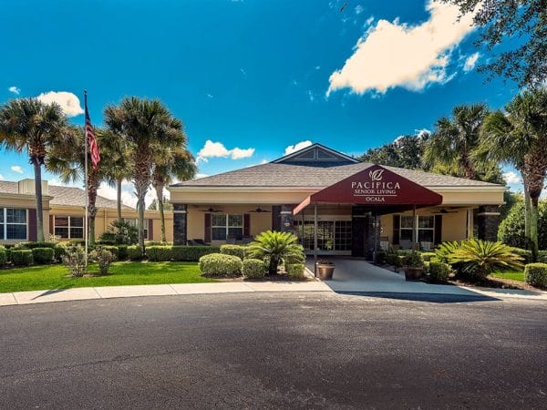 Entrance with awning covering sidewalk at Pacifica Senior Living Ocala
