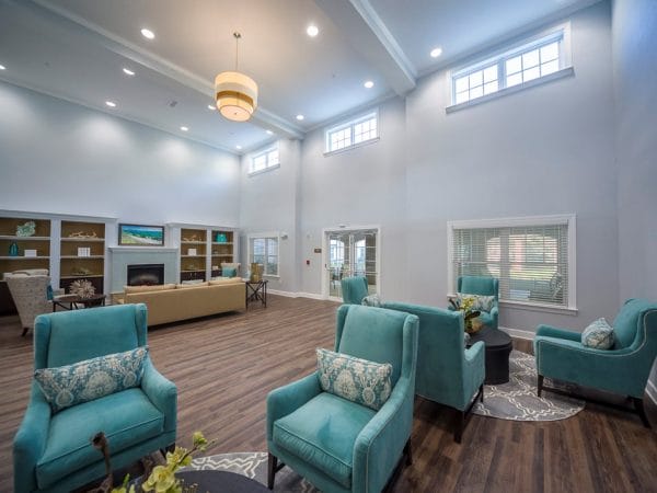 Resident gathering areas with sofas and chairs at in the lobby of Peyton Ridge Apartments