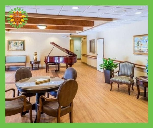 Seasons Belleair lobby with exposed rafters, grand piano and seating for residents and guests
