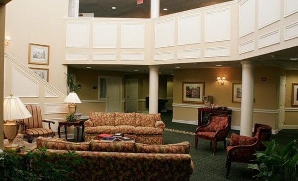 Lobby with sofas and seating for residents of Regency Pointe