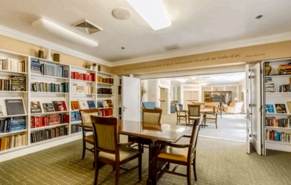 Resident library and gathering areas with tables and chairs at Rittenhouse Village At Northside