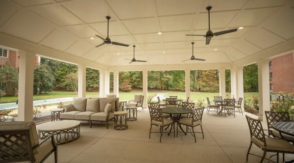 Mul;tiple seating options on the covered back porch at The Barrington at Hioaks