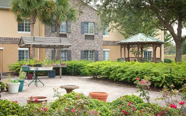 Superior Residences of Clermont courtyard with gazebo and lush gardens and sitting areas