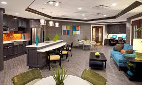 The Bristal Assisted Living Lake Grove lounge with contemporary furniture and breakfast bar area