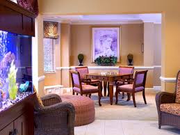 The Bristal Assisted Living at East Meadow resident common area with table, chairs and fish tank