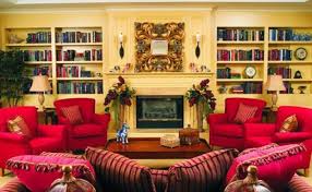 The Bristal Assisted Living at North Hills resident living room with overstuffed red chairs on either side of cozy fireplace