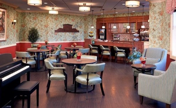 The Bristal Assisted Living at Woodcliff Lake lounge with bar area and cocktail tables