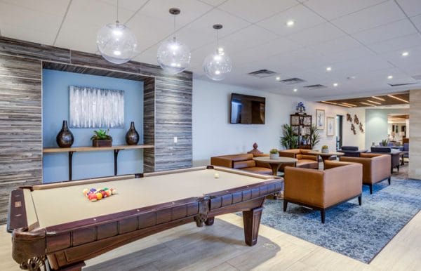 The Palazzo community game room with tan felt covered billiards table