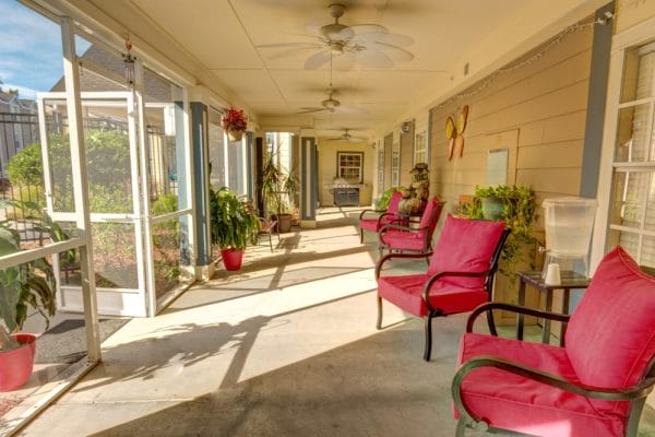 Front porch with red seats at Elevated Estates at New Port Richey