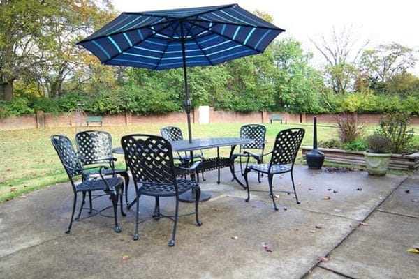 The Village at Bellevue patio with unbrella table