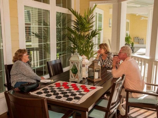 Residents around a checkerboard at Your Life of Pensacola