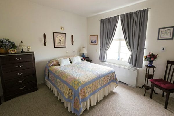 Model bedroom in an apartment at Brookdale Baywood