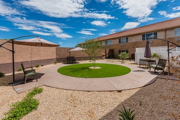 Brookdale Desert Ridge courtyard with a circle path and resident seating