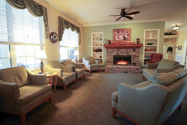 Fire side seating in the Brookdale Fort Myers Lakes Park community living room