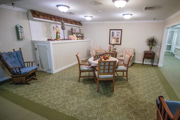 Common area with tables and chairs for residents of Brookdale Hampton Cove