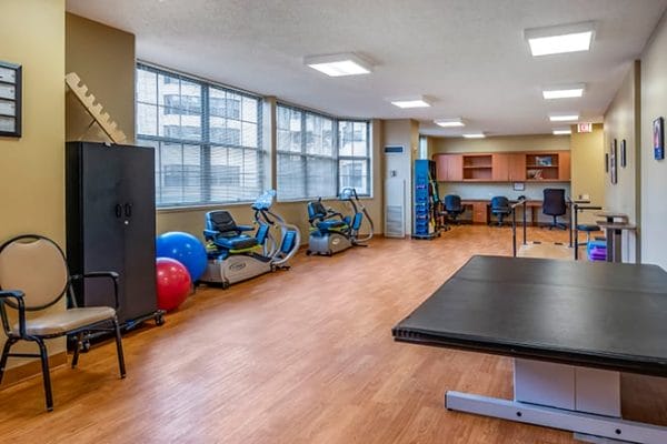 Therapy room filled with gym equipment in Brookdale Lisle