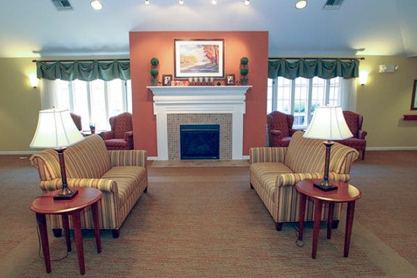 Cozy fireplace and resident seating in Brookdale Middleton Stonefield