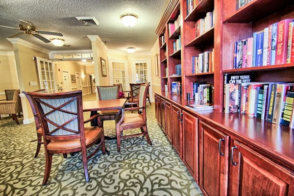 Library with dark wood book shelves in Brookdale New Hope