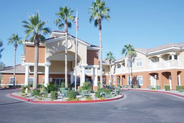 Brookdale North Scottsdale building front and entrance with tall palm trees in front