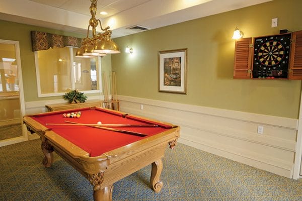 Brookdale North Scottsdale billiards room with a red felt pool table