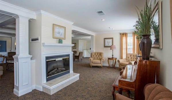 Community living room and fireplace at Chester Village Senior Apartments
