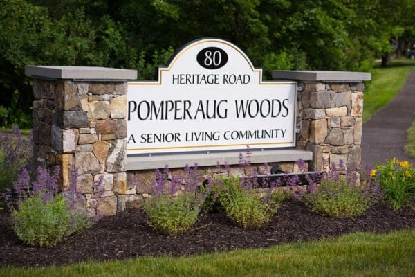 Welcome sign in front of Pomperaug Woods