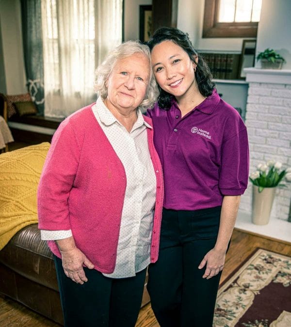 Home Instead Senior Care - San Antonio caregiver with senior woman in pink sweater
