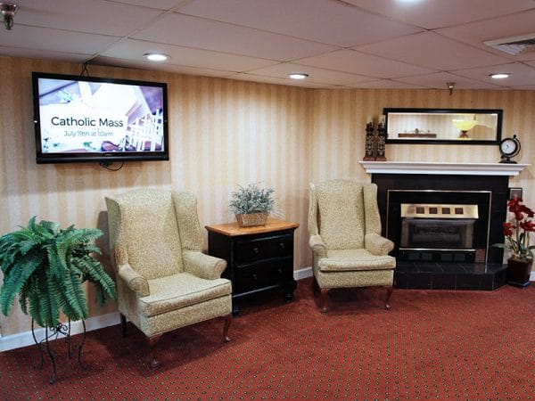 Regency Retirement Village - Huntsville community living room and fireplace