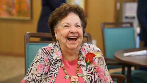 Senior female Red Rock Pointe Retirement resident laughing and smiling