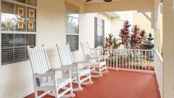 White rocking chairs on the Sunflower Springs - Homosassa porch