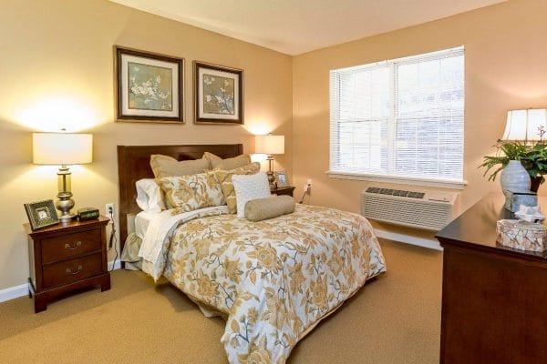 Model bedroom in a The Village at Brookfield Common residence