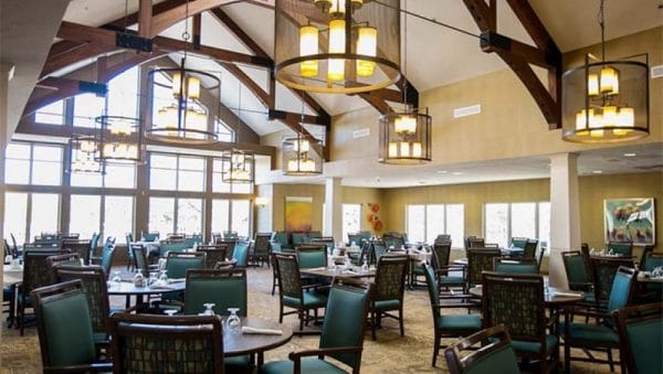 Vickery Rose Retirement community dining room with large exposed wooden trusses