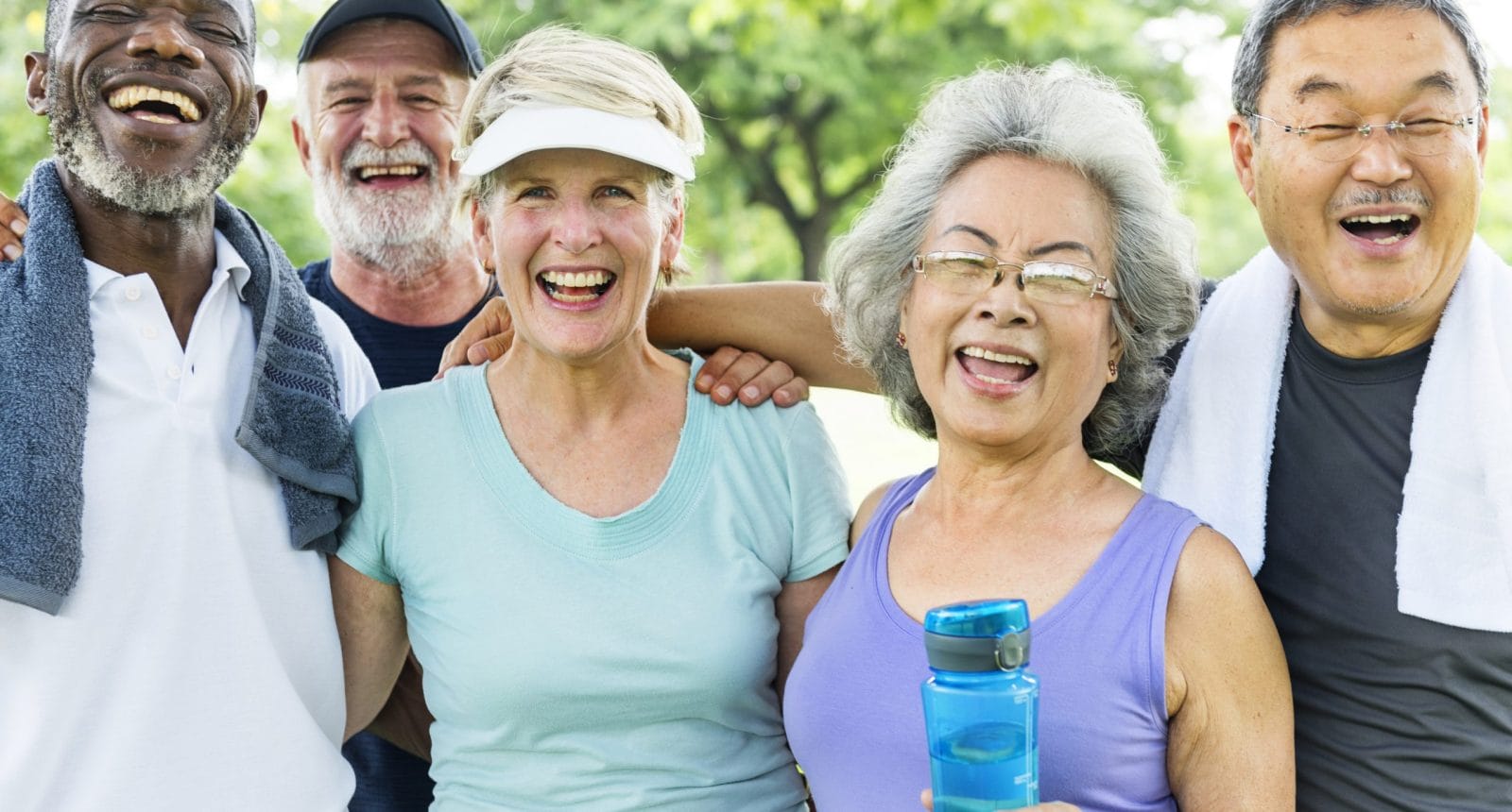 Group of diverse seniors smiling and laughing after exercise