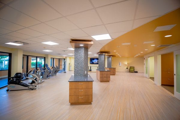 Stone Rehabilitation Center interior with exercise equipment in back
