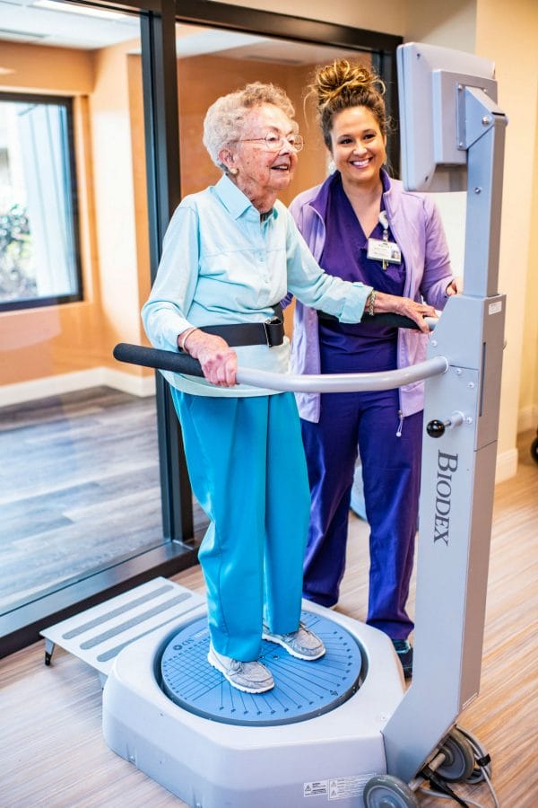 Stone Rehabilitation Center female senior patient using thereapy machine