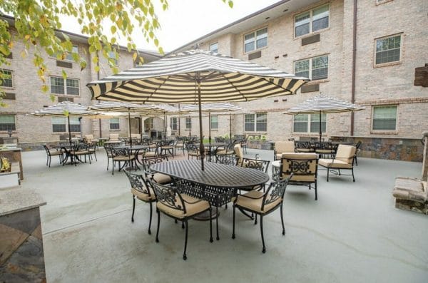 Umbrella covered tables on the Heatherwood courtyard