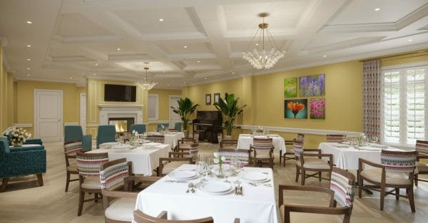 The Bristal at Bethpage Dining with fireplace and piano